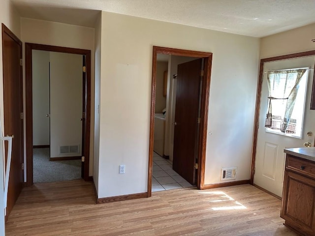 1429 Quick Dr, Espyville, PA 16424 - unfurnished bedroom featuring light wood-type flooring, washer / dryer, and baseboards