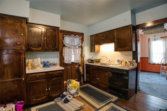 1219 W 32nd St, Erie, PA 16508 - kitchen with light countertops, dark brown cabinetry, dark wood finished floors, and black dishwasher