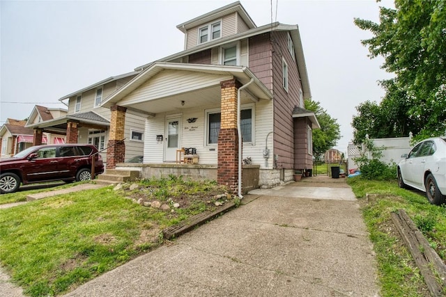 1219 W 32nd St, Erie, PA 16508 - view of front of house with a porch and concrete driveway