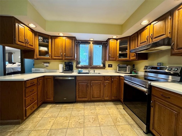 kitchen featuring sink, stainless steel electric range oven, dishwasher, and light tile patterned floors