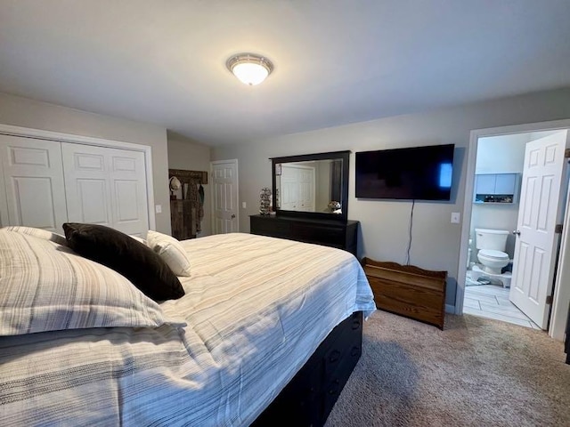 carpeted bedroom featuring connected bathroom