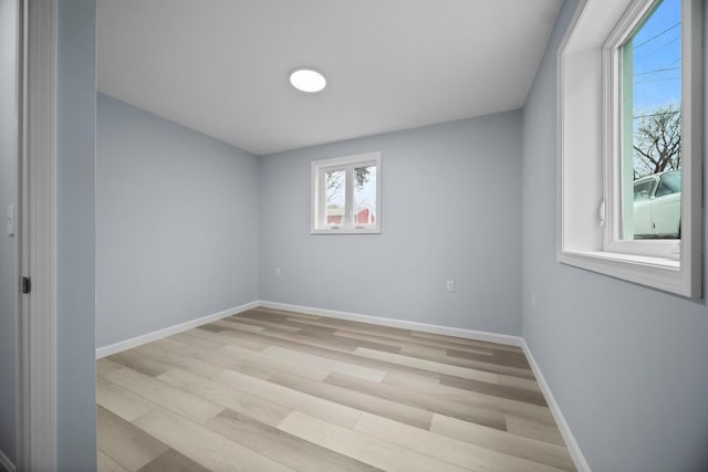 unfurnished room with light hardwood / wood-style flooring