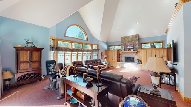 carpeted living room featuring a stone fireplace, a wealth of natural light, and high vaulted ceiling