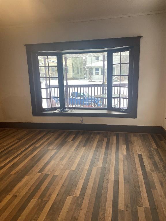 unfurnished room featuring dark hardwood / wood-style floors