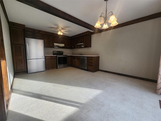 kitchen with beam ceiling, sink, dark brown cabinetry, hanging light fixtures, and stainless steel appliances