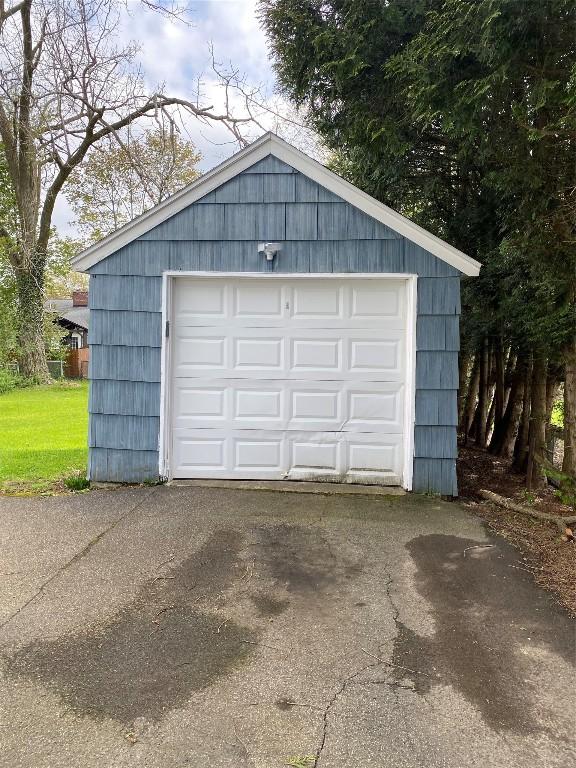 detached garage with aphalt driveway