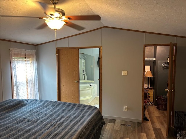 263 W Jamestown Rd, Jamestown, PA 16134 - bedroom with a spacious closet, wood finished floors, vaulted ceiling, crown molding, and a closet