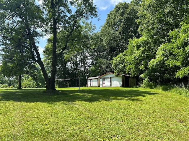 263 W Jamestown Rd, Jamestown, PA 16134 - view of grassy yard featuring a garage and an outdoor structure