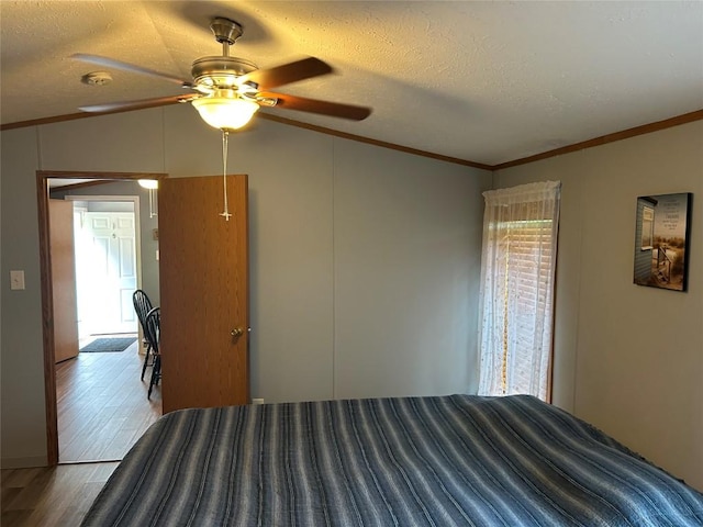 263 W Jamestown Rd, Jamestown, PA 16134 - bedroom featuring wood finished floors, ornamental molding, lofted ceiling, ceiling fan, and a textured ceiling