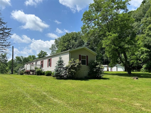 263 W Jamestown Rd, Jamestown, PA 16134 - view of property exterior featuring a yard and a garage