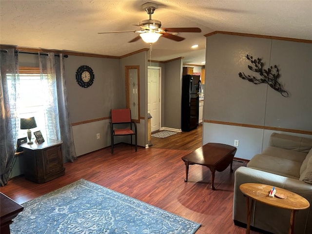 263 W Jamestown Rd, Jamestown, PA 16134 - living room with a ceiling fan, wood finished floors, crown molding, lofted ceiling, and a textured ceiling