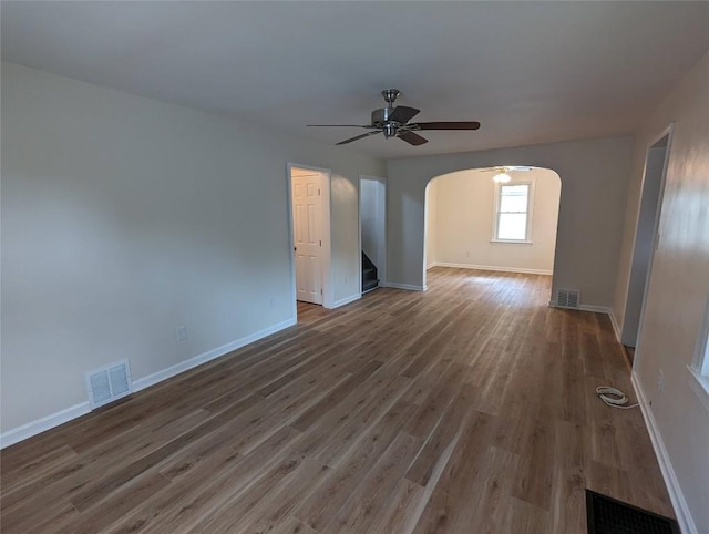 empty room featuring hardwood / wood-style floors and ceiling fan