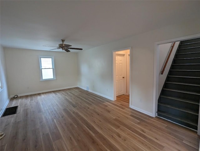 spare room featuring ceiling fan and hardwood / wood-style floors