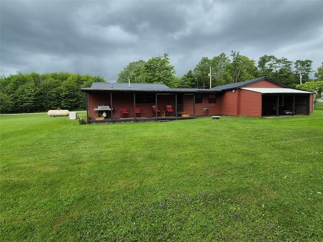 26418 State Highway 18, Albion, PA 16401 - back of house with a yard and a metal roof