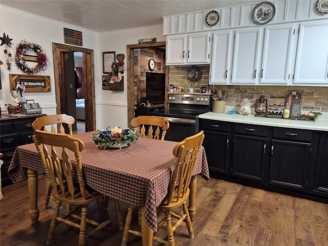 26418 State Highway 18, Albion, PA 16401 - dining room featuring light wood-type flooring and wainscoting