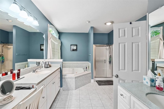 6262 Cobblestone Dr, Millcreek, PA 16509 - bathroom featuring a shower stall, vanity, a tub with jets, tile patterned flooring, and a textured ceiling
