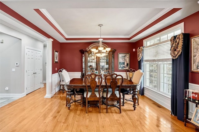 6262 Cobblestone Dr, Millcreek, PA 16509 - dining space with a chandelier, plenty of natural light, light wood-style flooring, ornamental molding, and a raised ceiling