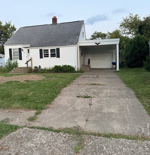 view of front of house with a front lawn and a garage