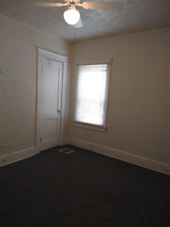 spare room with ceiling fan