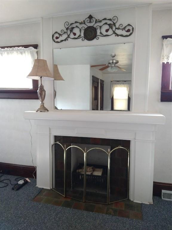 room details featuring carpet and ceiling fan