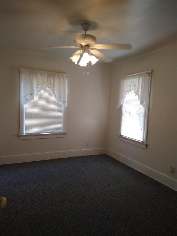 unfurnished room with ceiling fan and carpet floors