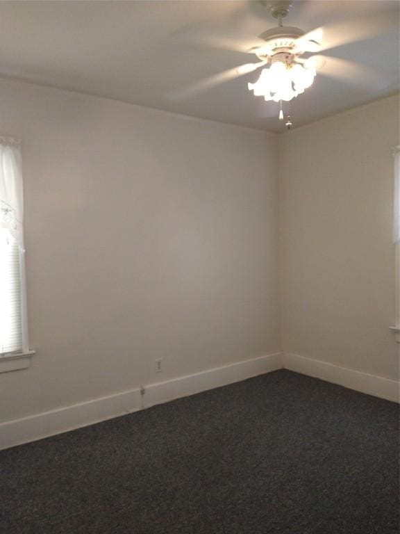 unfurnished room with carpet flooring and ceiling fan