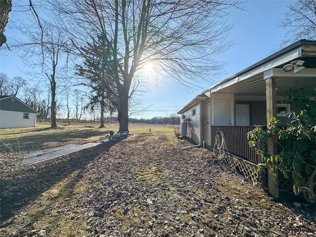 view of yard with covered porch