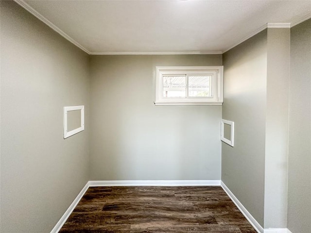 empty room with ornamental molding, dark wood-type flooring, and baseboards