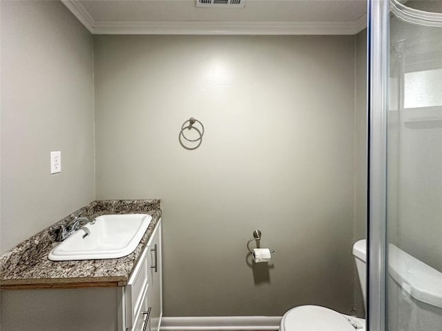 bathroom with toilet, visible vents, ornamental molding, and vanity