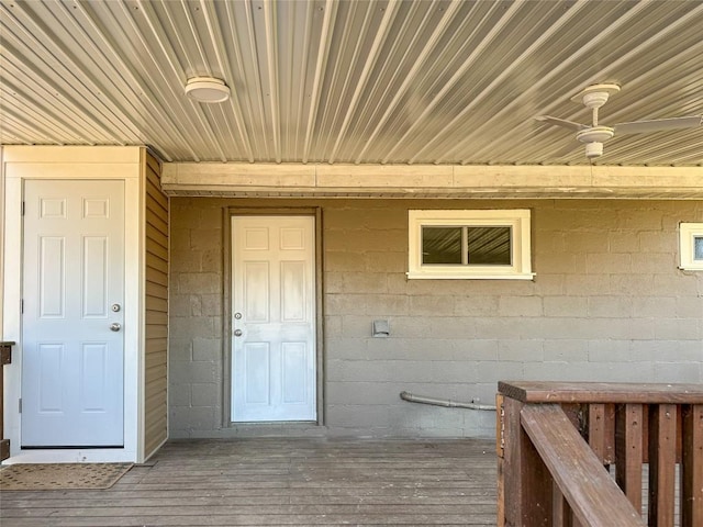 doorway to property featuring concrete block siding