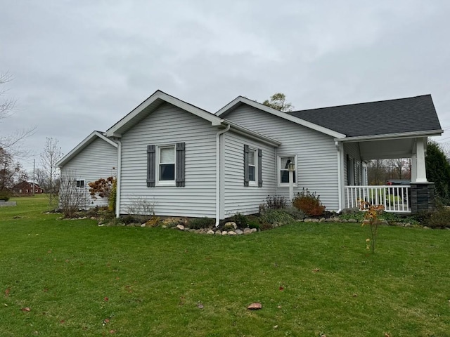 exterior space featuring a lawn and a porch