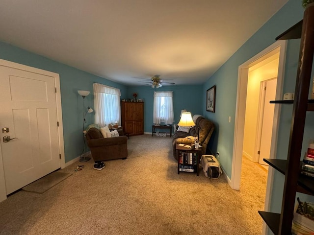 living room featuring ceiling fan and light carpet