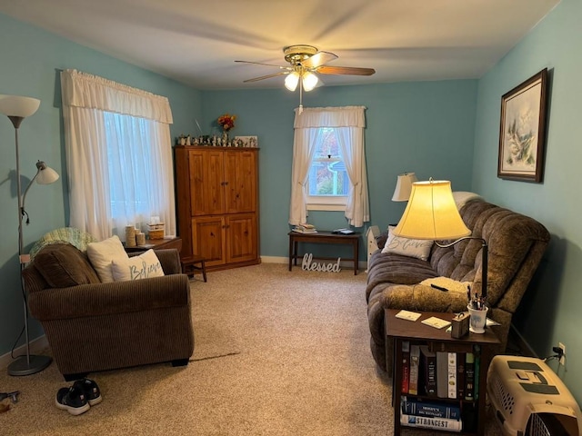 living room with ceiling fan and carpet floors