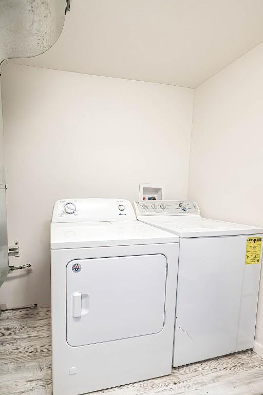 10220 Barton Rd, Waterford, PA 16441 - laundry room featuring washer and clothes dryer and light wood-type flooring