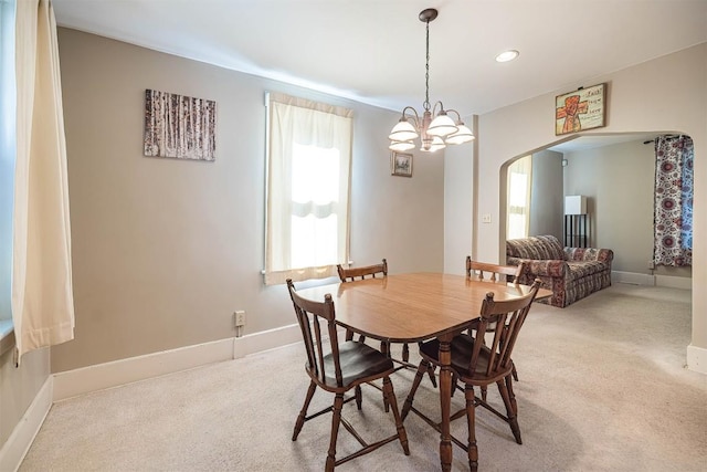 1047 Napier Ave, Erie, PA 16511 - dining area with arched walkways, light carpet, baseboards, a chandelier, and recessed lighting