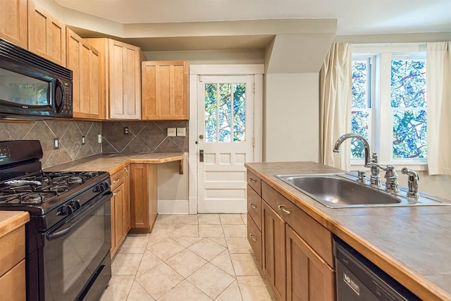 1047 Napier Ave, Erie, PA 16511 - kitchen featuring black appliances, a sink, tasteful backsplash, and plenty of natural light