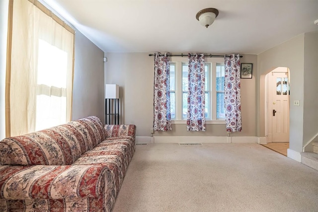 1047 Napier Ave, Erie, PA 16511 - carpeted living room with arched walkways and baseboards
