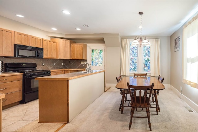 1047 Napier Ave, Erie, PA 16511 - kitchen featuring black appliances, a sink, backsplash, recessed lighting, and hanging light fixtures