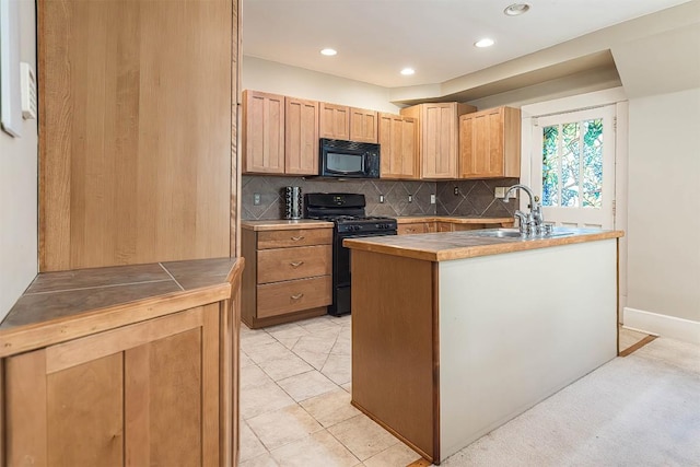 1047 Napier Ave, Erie, PA 16511 - kitchen featuring black appliances, decorative backsplash, a sink, recessed lighting, and tile counters