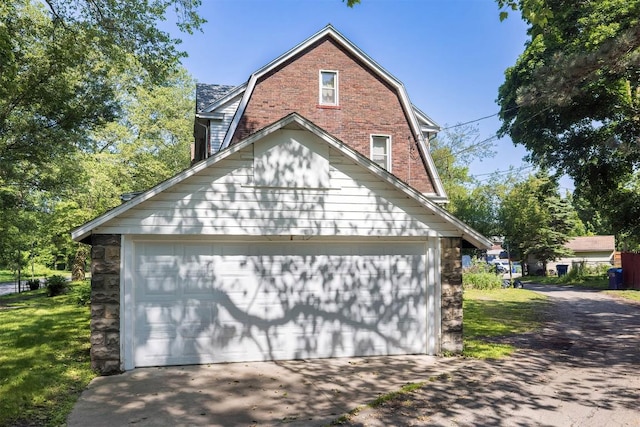 1047 Napier Ave, Erie, PA 16511 - view of property exterior with a gambrel roof and a garage