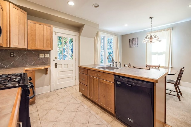 1047 Napier Ave, Erie, PA 16511 - kitchen featuring dishwasher, a sink, gas stove, a chandelier, and decorative backsplash