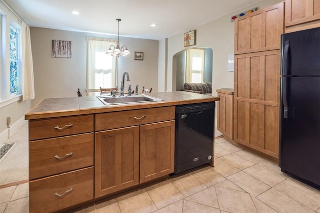 1047 Napier Ave, Erie, PA 16511 - kitchen with black appliances, a sink, brown cabinets, arched walkways, and light tile patterned floors