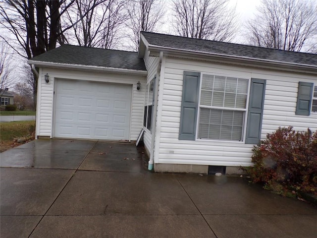 view of side of home with a garage