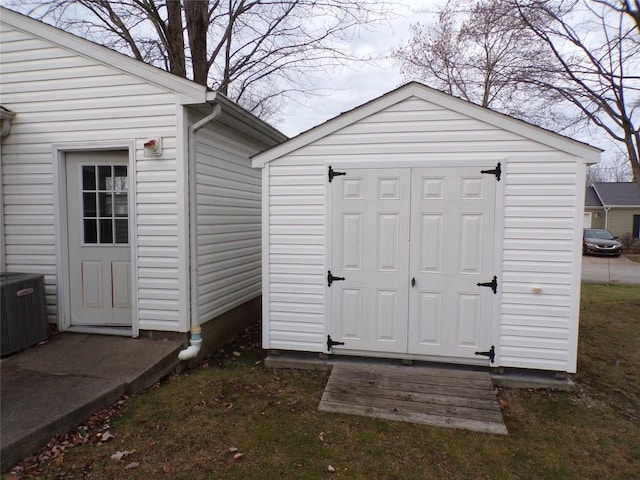 view of outbuilding featuring central air condition unit