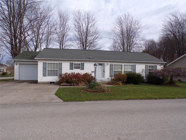 single story home featuring a garage and a front lawn