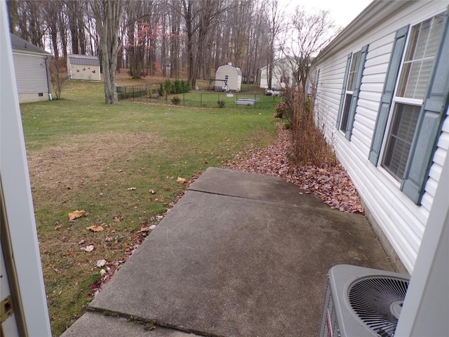 view of yard featuring ac unit and a patio