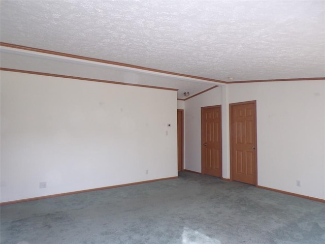 unfurnished room featuring carpet, ornamental molding, a textured ceiling, and vaulted ceiling