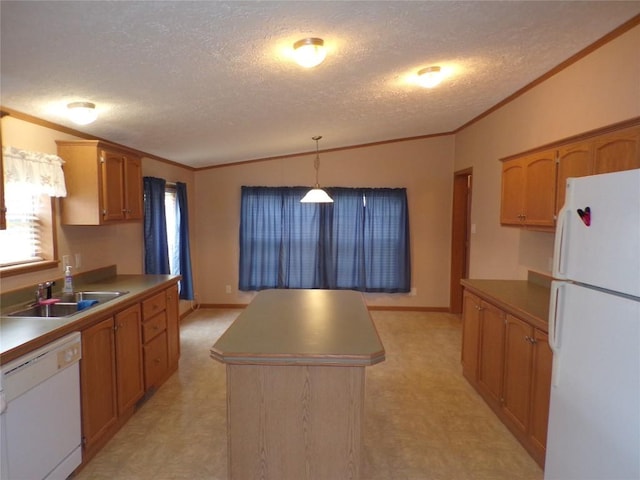 kitchen with white appliances, sink, a textured ceiling, decorative light fixtures, and a kitchen island