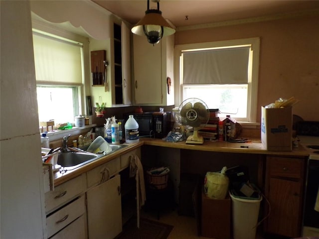 11898 Neiger Rd, Girard, PA 16417 - kitchen with healthy amount of natural light, black microwave, white cabinets, and light countertops