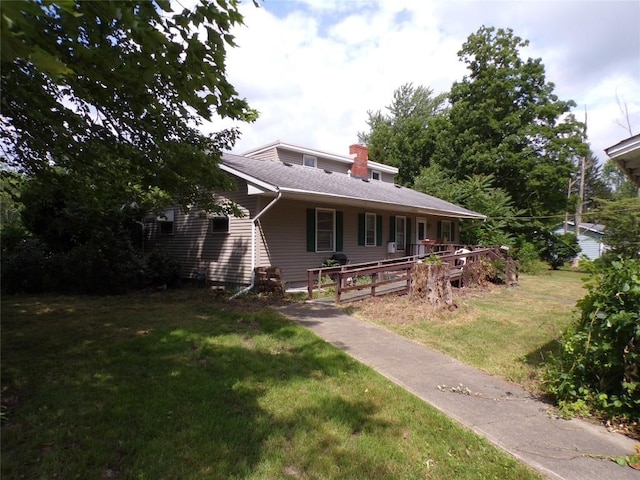 11898 Neiger Rd, Girard, PA 16417 - view of front of home with a porch, a front yard, and a chimney